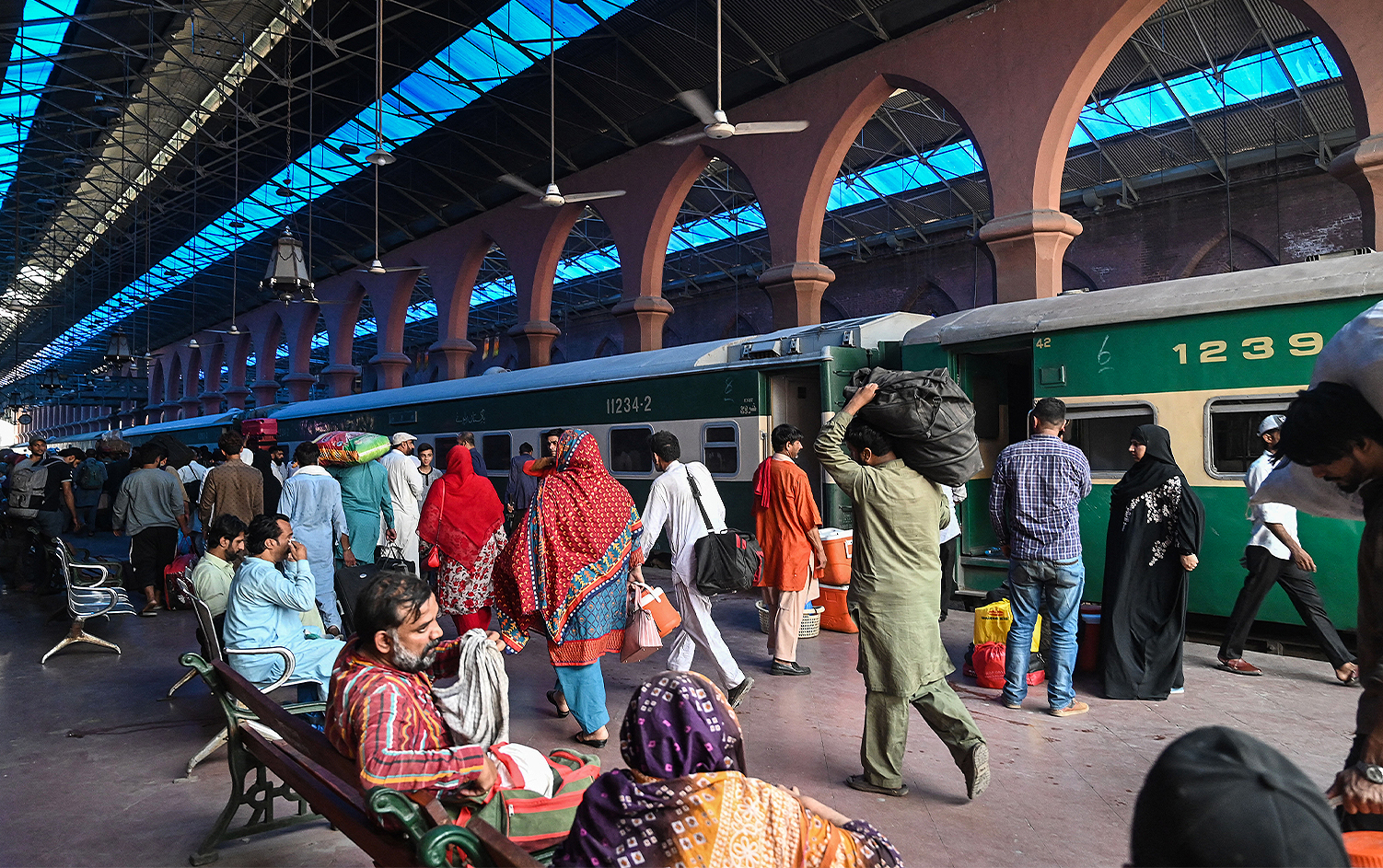 People gather at a railway station to travel to their native places to celebrate Eid al-Fitr, which marks the end of the Muslim's holy festival of Ramadan in Lahore on May 1, 2022. (AFP/File)