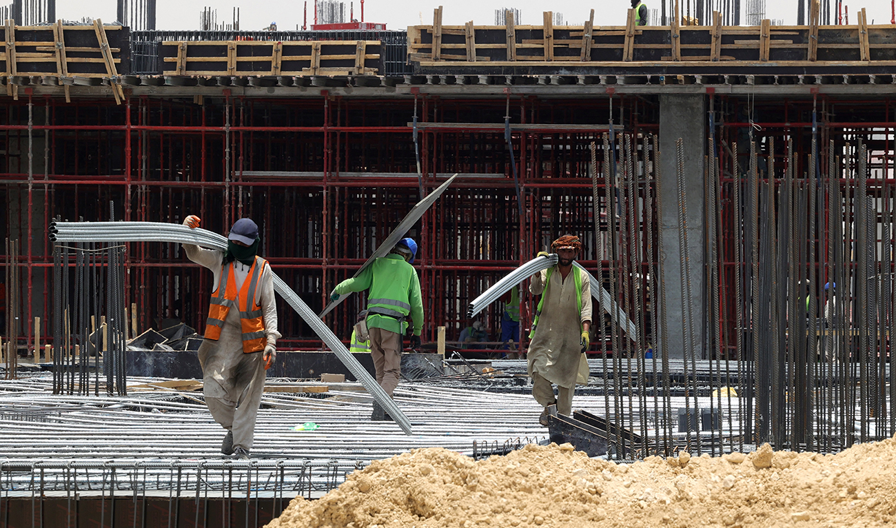 Foreign labourers work at a construction site in the Saudi capital Riyadh, on June 16, 2022. (AFP/File)