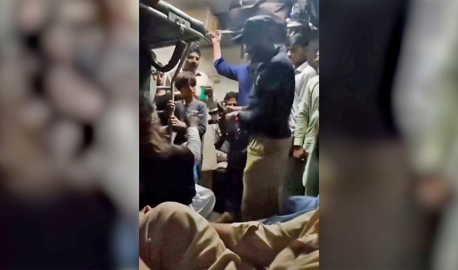 SENSITIVE MATERIAL – This still image from social media video obtained by Arab News Pakistan on April 16, 2024, shows Constable Mir Hasan allegedly beating Maryam Bibi on a train last week. (@SafinaKhann/X)