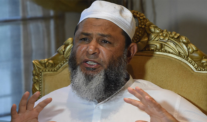 In this picture taken on September 24, 2021, former Pakistani cricketer Mushtaq Ahmed gestures as he speaks during an interview with AFP in Lahore. (AFP)