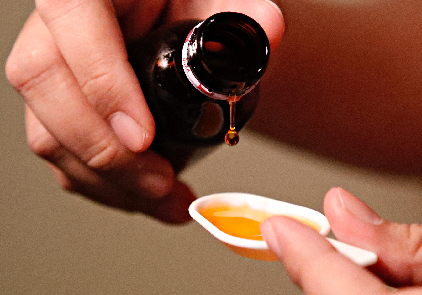 A cough medication is poured in this picture illustration taken October 19, 2022. (REUTERS)