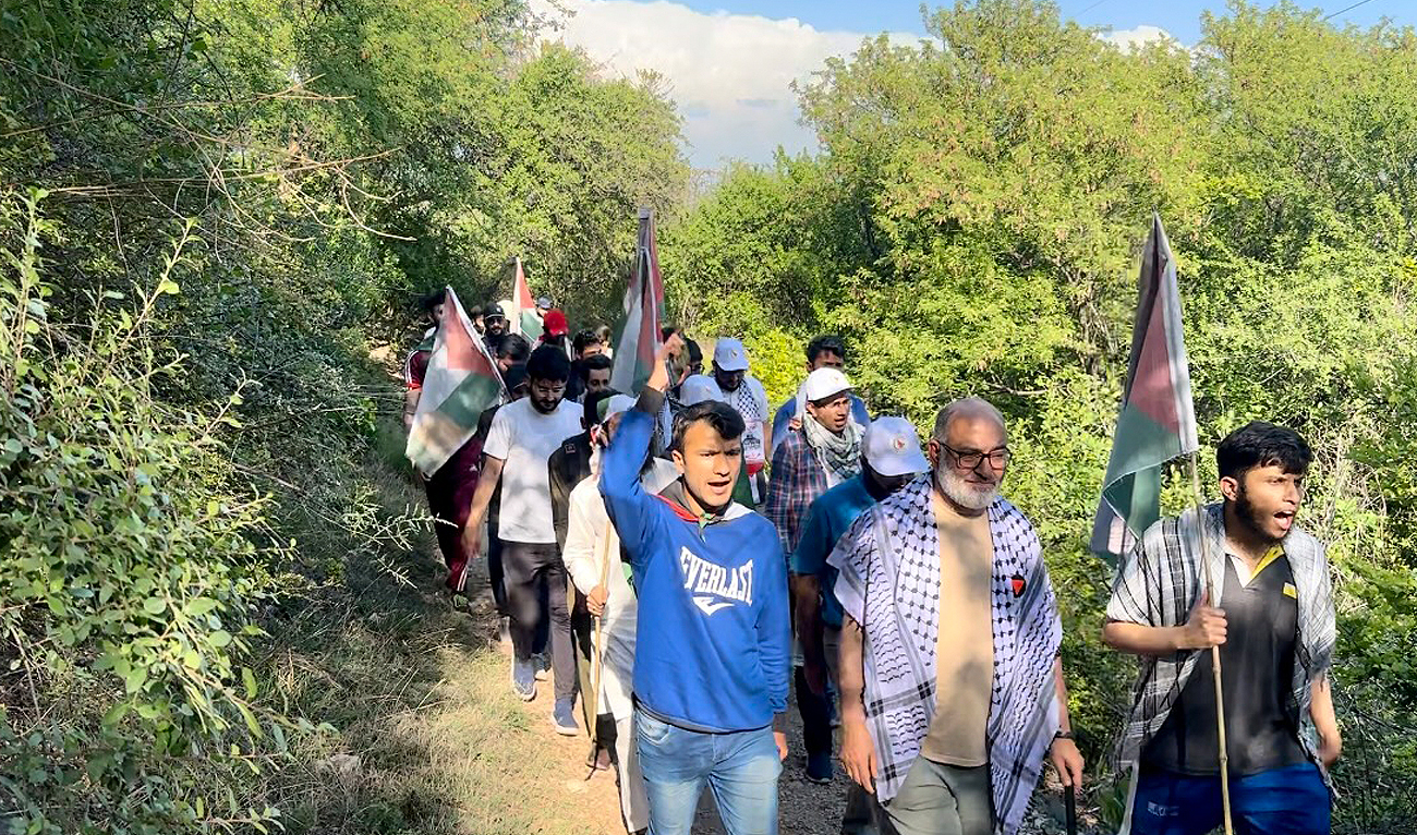 Participants chant slogan as they walk through Margalla Hills trail during “Save Gaza” campaign hike in Islamabad on April 21, 2024. (AN Photo)
