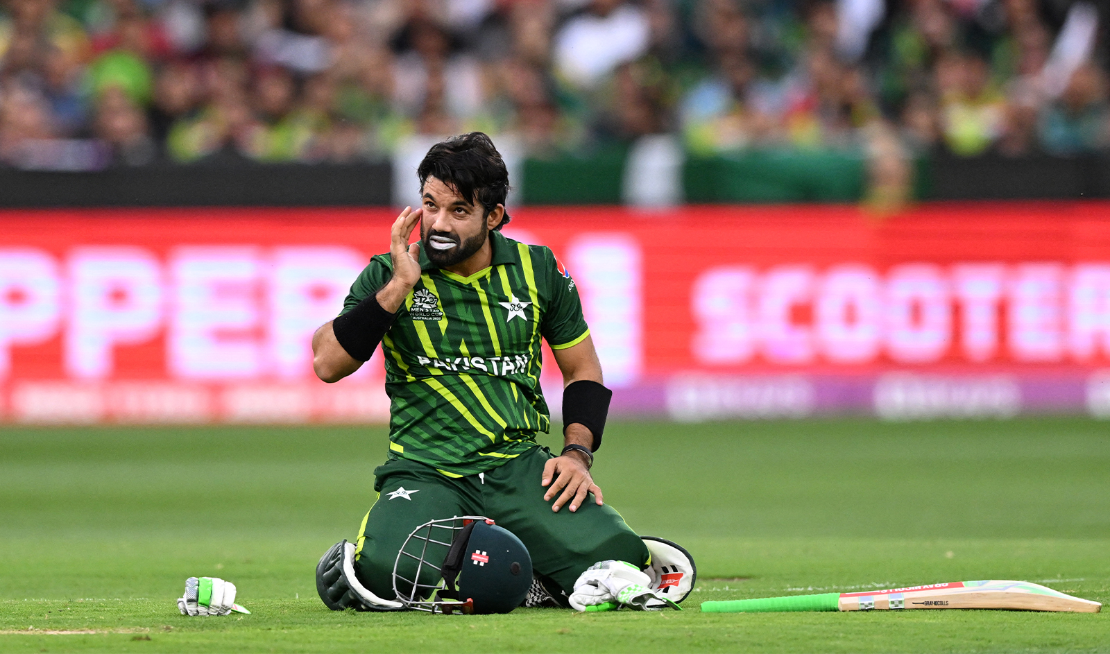 Pakistan's Muhammad Rizwan reacts after being hit by a delivery during the ICC men's Twenty20 World Cup 2022 final cricket match England and Pakistan at The Melbourne Cricket Ground in Melbourne, Australia, on November 13, 2022. (AFP/File)
