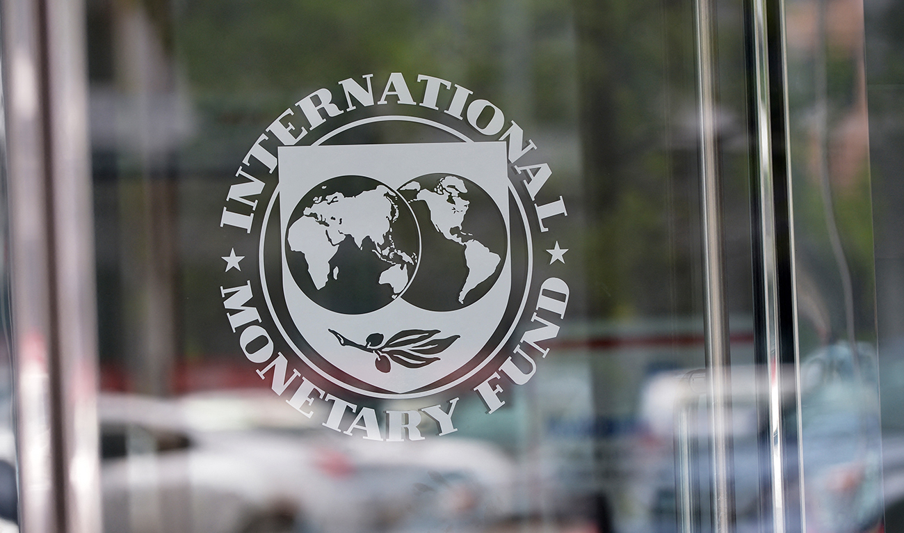 The seal of the International Monetary Fund is seen at the headquarters building in Washington, DC on July 5, 2015. (AFP/File)