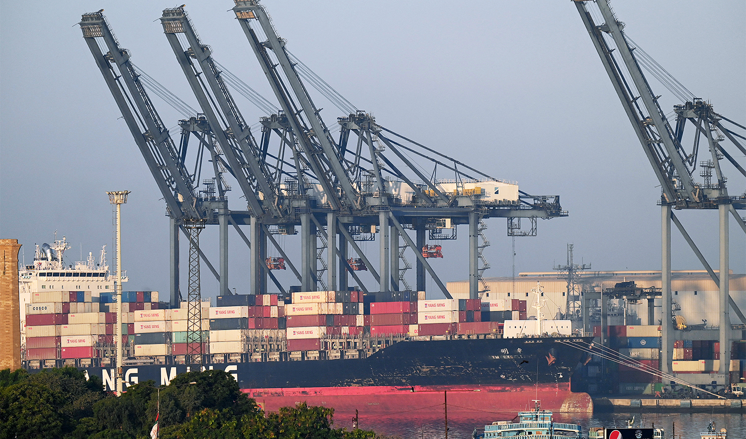 Shipping containers are seen stacked on a ship at a sea port in Karachi on April 6, 2023. (AFP/File)