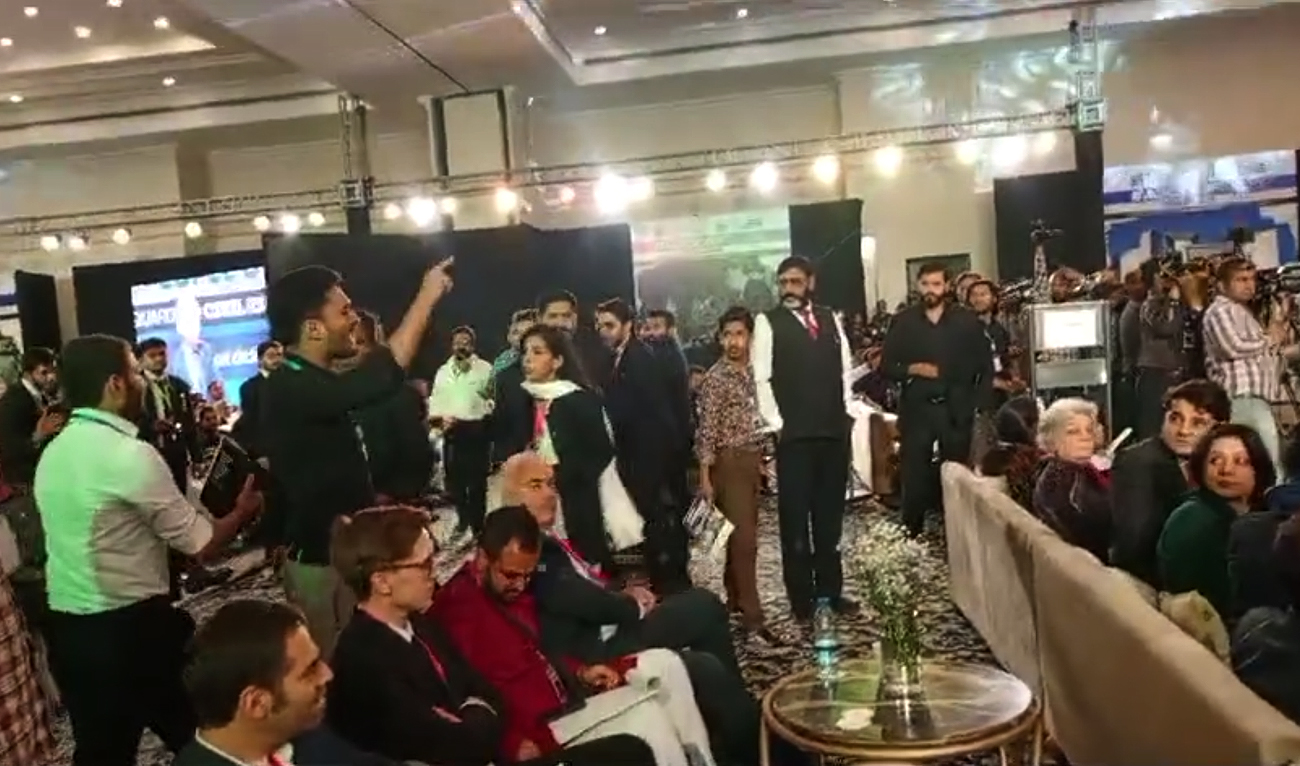 This screengrab shows Pakistani activist, Ali Abdullah Khan, speaking while interrupting speech by German Ambassador to Pakistan Alfred Grannas during a right conference in Lahore on April 27, 2024. Ambassador Grannas was speaking on safeguarding civil rights in South Asia when his speech was interrupted. (Photo courtesy: Facebook/Progressive Students Collective)
