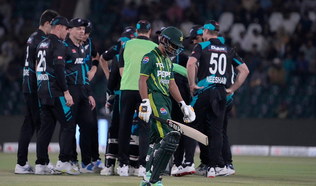 Pakistan’s Saim Ayub, center front, walks off the field after losing his wicket during the fifth T20 international cricket match between Pakistan and New Zealand, in Lahore, Pakistan, Saturday, April 27, 2024. (AP)