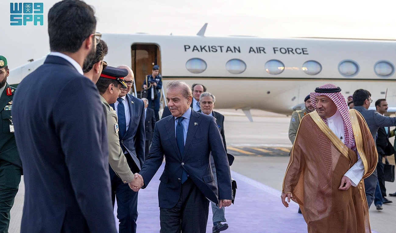 In this handout photo, taken and released by the Saudi Press Agency, Pakistan Prime Minister meets Saudi officials as he arrives in Riyadh on April 27, 2024, to attend the World Economic Forum scheduled to be held on April 28-29. (SPA)