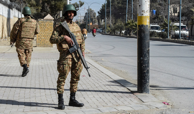 Pakistani army personnel stand guard along a road in Quetta on February 7, 2024. (AFP/File)