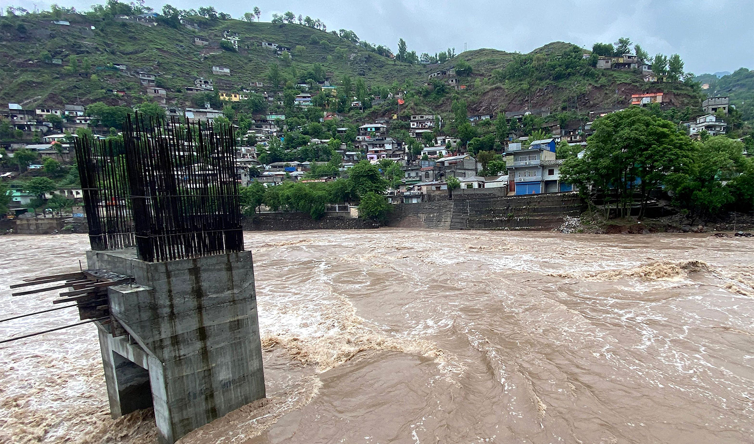 A general view of an overflowing Jhelum River after heavy rainfall in Muzaffarabad in Pakistan-administered Kashmir on April 29, 2024. (AFP)