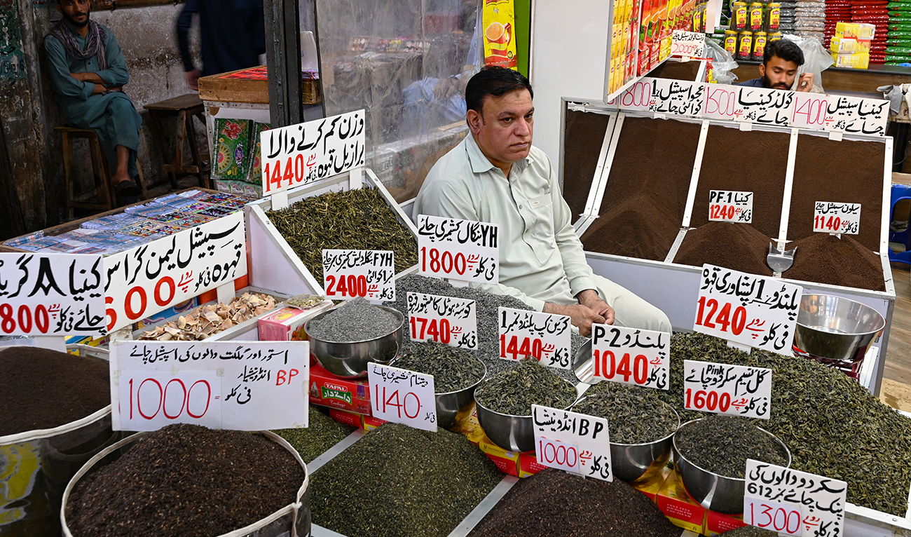 A tea seller waits for customers at his shop in a market in Rawalpindi on June 1, 2023. (AFP/File)
