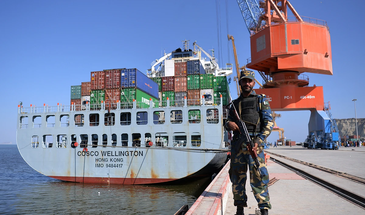 In this photograph taken on November 13, 2016, Pakistani Naval personnel stand guard near a ship carrying containers at the Gwadar port, some 700 kms west of Karachi, during the opening ceremony of a pilot trade programme between Pakistan and China. (AFP/File)