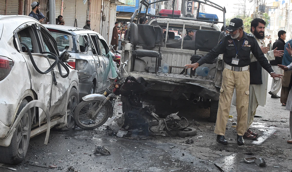 A police officer examines the site of a bomb blast in Quetta on April 10, 2023. (AFP/file)
