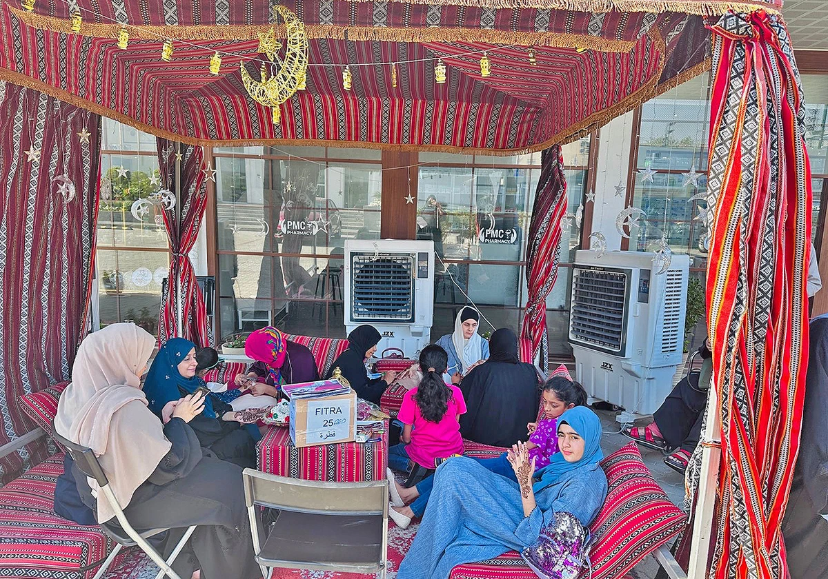 Women apply henna at an Eid festival organized by Pakistan Association in Dubai, UAE on April 7, 2024. (Pakistan Association Dubai)