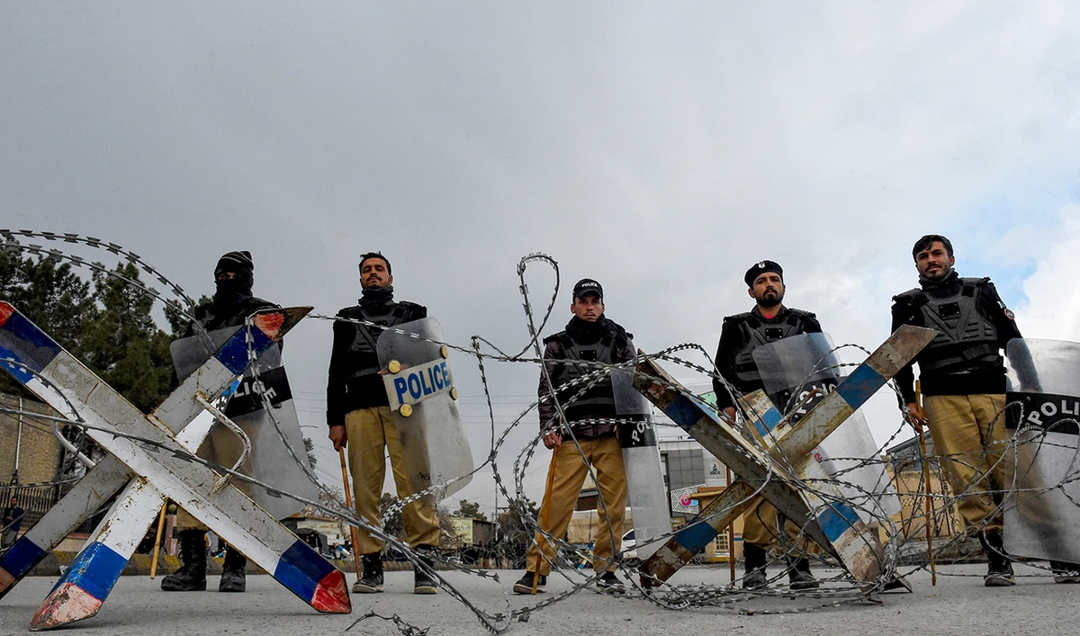 Police personnel set roadblocks as Pashtunknwa National Awami Party members protest in Quetta on February 28, 2024. (AFP/File)