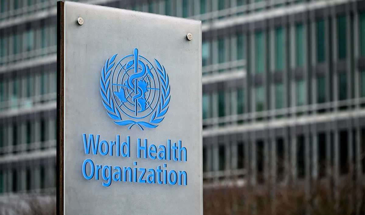 This photograph taken on December 2, 2021, shows a sign of the the World Health Organization (WHO) next to theirs headquarters, in Geneva. (AFP/File)