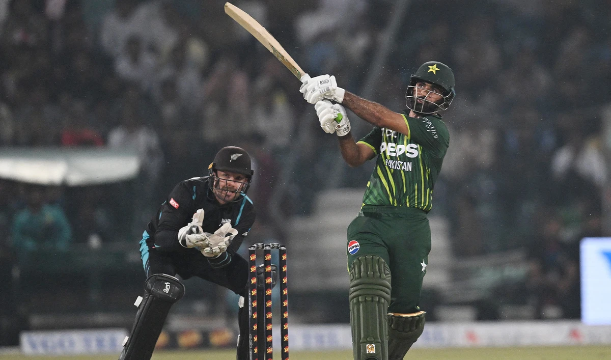 Pakistan's Fakhar Zaman (R) hits a six during the fourth Twenty20 international cricket match between Pakistan and New Zealand at the Gaddafi Cricket Stadium in Lahore on April 25, 2024. (AFP)
