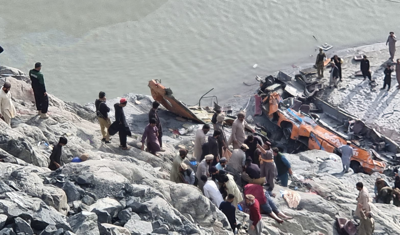 Rescue workers and local residents search for victims in the wreckage of a bus following an accident in Diamer district of Gilgit-Baltistan region on May 3, 2024. (Photo courtesy: SSP Diamer Sardar Sheheryar Khan/ Facebook)