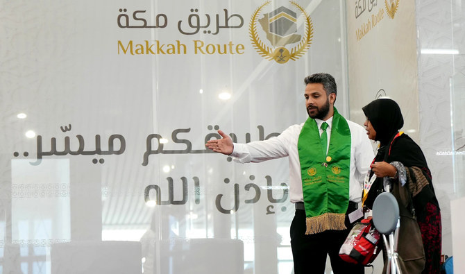 In this file photo, taken on May 29, 2023, a volunteer guides an elderly pilgrim arriving for Hajj in Makkah, Saudi Arabia. (SPA/File)