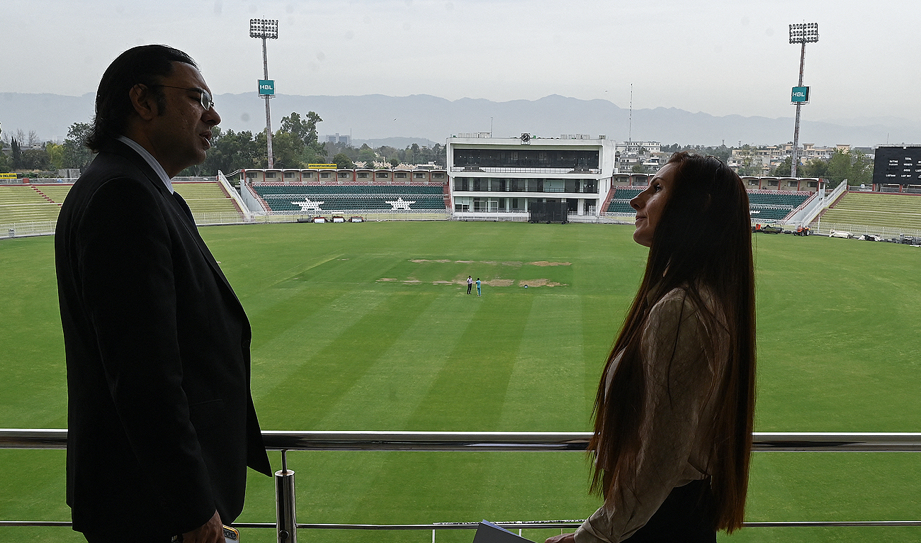 In this file photo, taken on March 27, 2024, Sarah Edgar (R), Senior Manager for event operations at International Cricket Council (ICC) talks with Usman Wahla, Director of International cricket at Pakistan Cricket Board (PCB) as she reviews the preparations for the ‘Champions Trophy 2025’ at the Rawalpindi Cricket Stadium in Rawalpindi. Pakistan is due to host the eight-nation Champions Trophy in February 2025. (AFP/File)