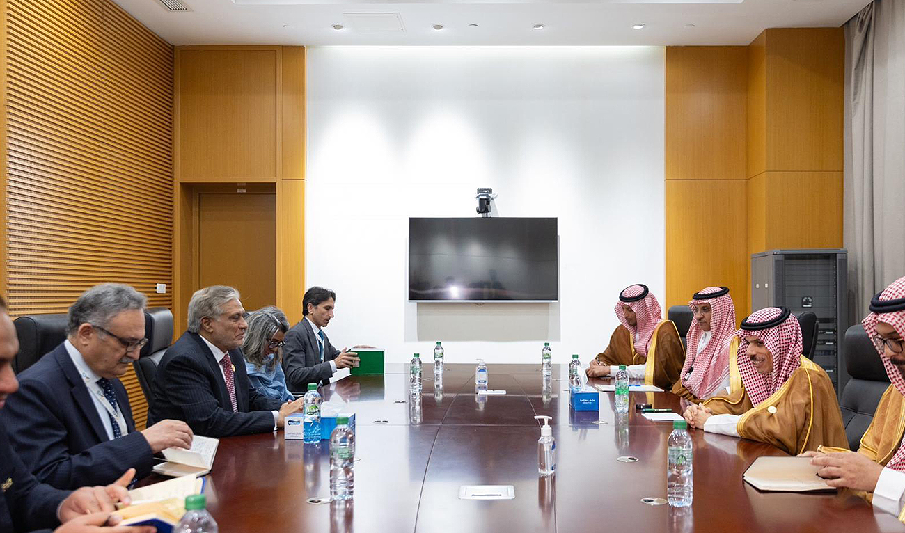 In this handout photograph, taken and released by Saudi Press Agency, Pakistan’s newly appointed Deputy Prime Minister Ishaq Dar (center, left) meets with Saudi Foreign Minister Prince Faisal bin Farhan (center, right) on the sidelines of the Organization of Islamic Cooperation summit in Gambia on May 4, 2024. (SPA)
