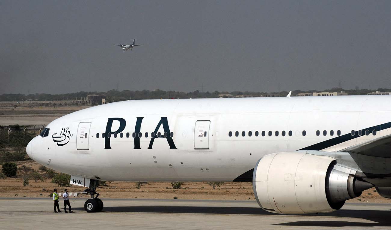 A London-bound state-run Pakistan International Airlines (PIA) plane taxies before take-off from Karachi International Airport in Karachi on April 21, 2010. (AFP/File)