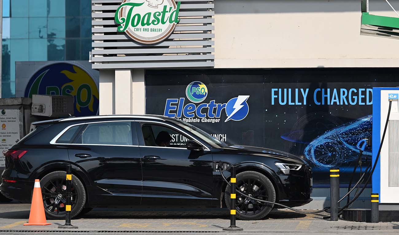 An electic car is being charged at a charging station in Islamabad on February 16, 2022. (AFP/File)