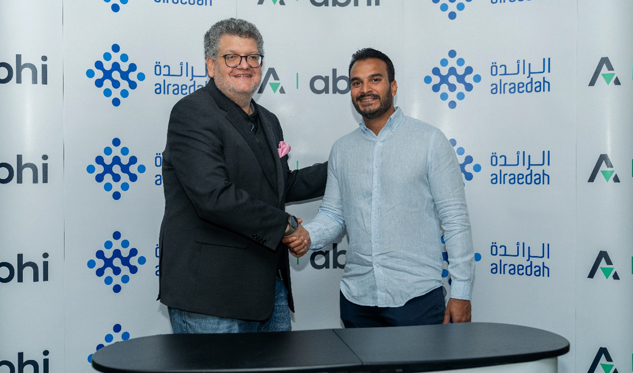 In this handout photograph, taken and released by Pakistani startup Abhi on May 9, 2024, Abhi and Alraedah Digital Solutions, a leading Saudi technology company, officials shake hands during the sigining of a partnership agreement. (Photo courtesy: Abhi)