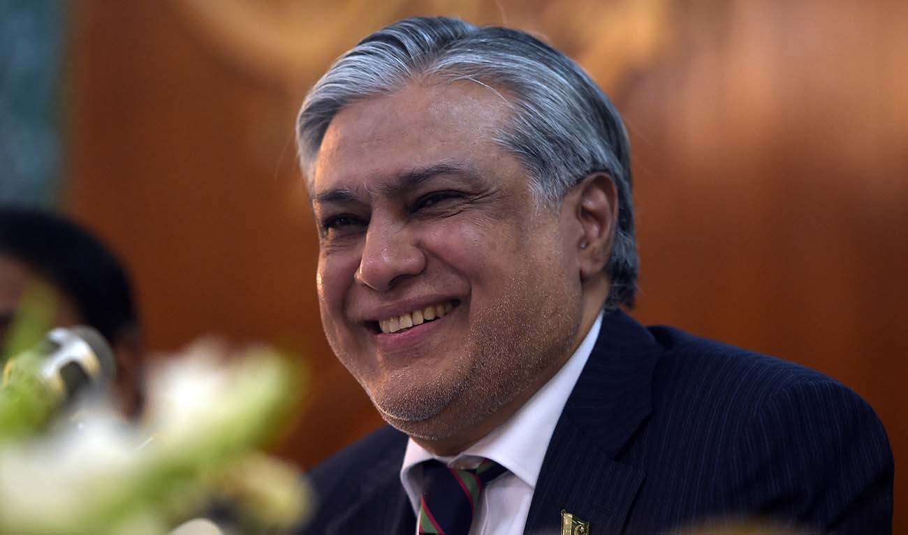 Pakistan’s Deputy Prime Minister and Foreign Minister Ishaq Dar smiles as he speaks after the launch of the "Pakistan Economic Survey 2015-16" report during a press conference in Islamabad on June 2, 2016. (AFP/File)