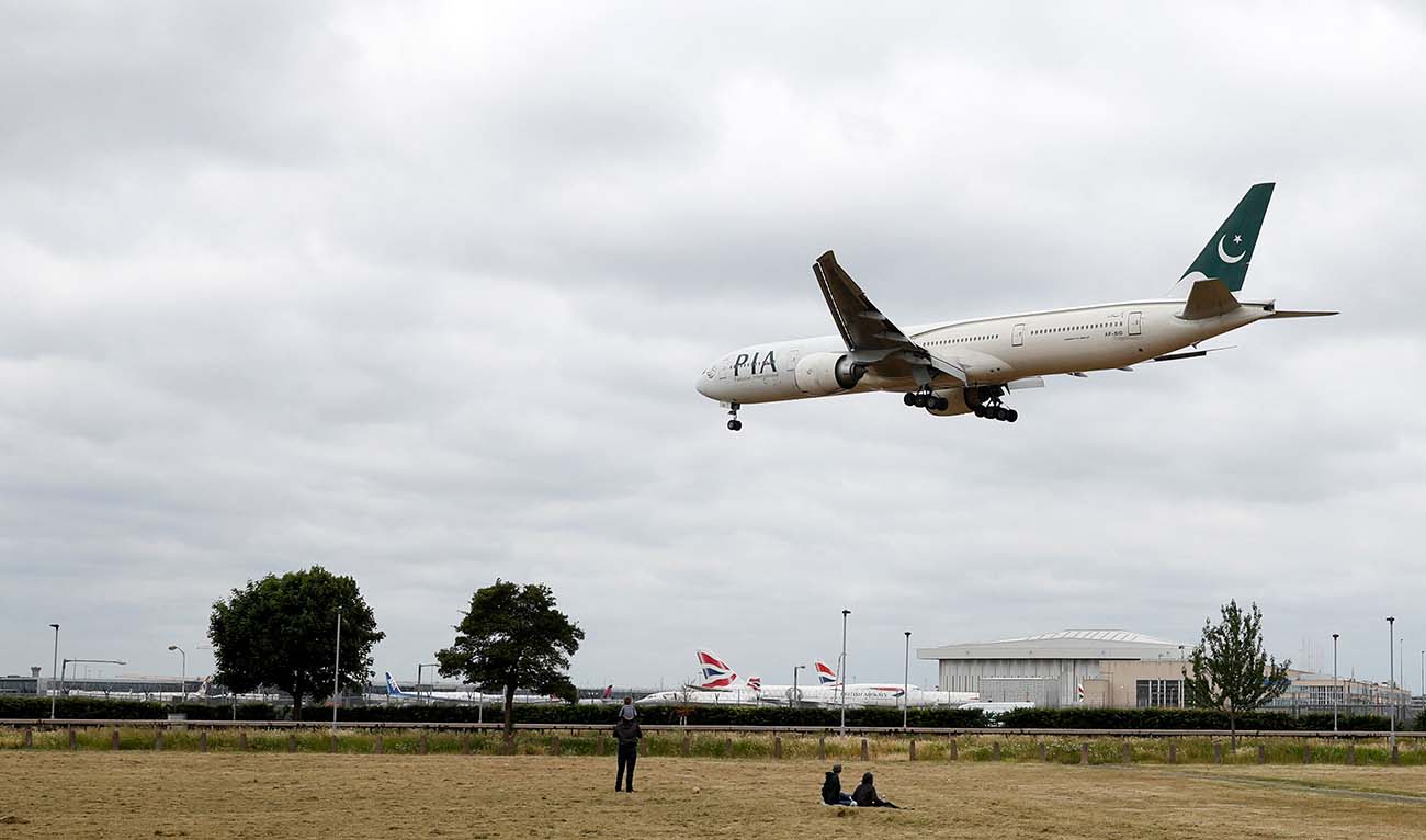 A Pakistan International Airlines Boeing 777 comes in to land at Heathrow airport in west London as the UK government's planned 14-day quarantine for international arrivals to limit the spread of Covid-19 starts on June 8, 2020. (AFP/File)