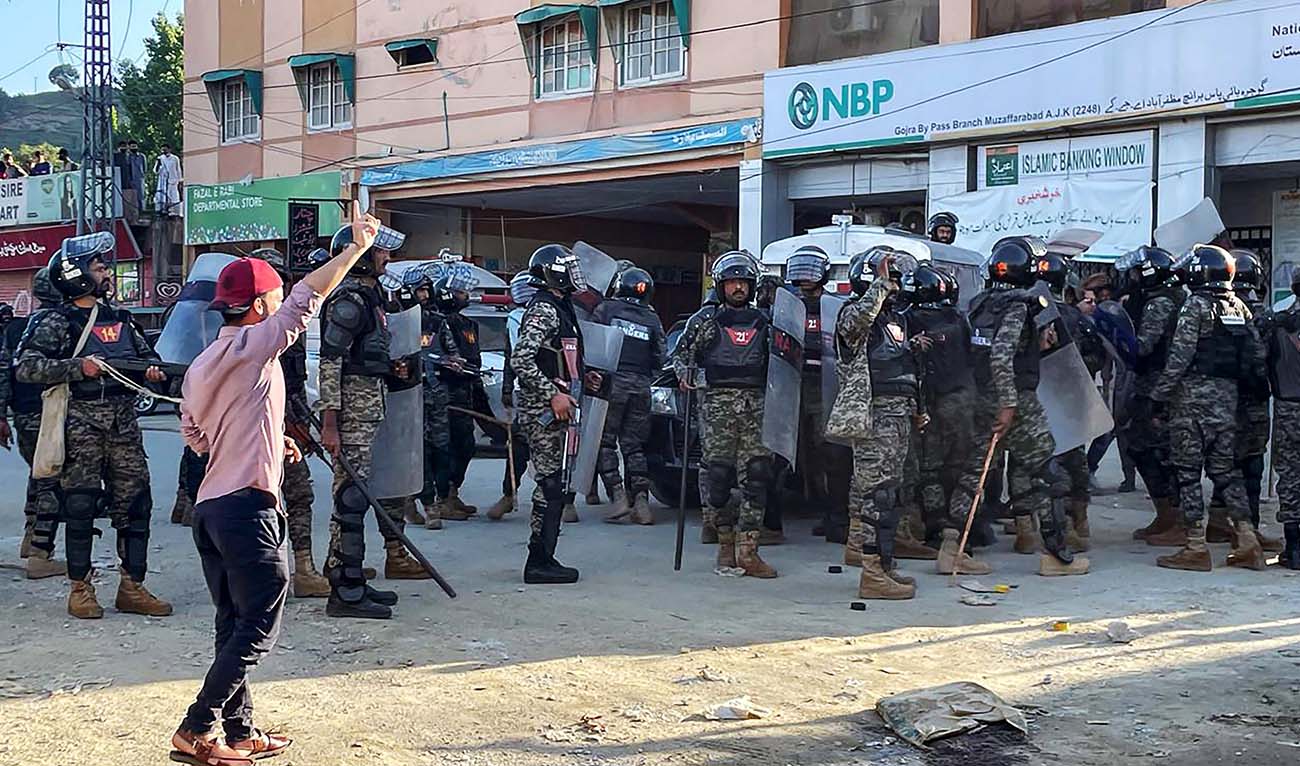 Pakistani rangers cordon off a street during a protest by Kashmiri demonstrators of Jammu Kashmir Joint Awami Action Committee (JAAC) to condemn the soaring electricity and flour prices, on the outskirt of Muzaffarabad, the capital of Pakistan-administered Kashmir on May 13, 2024. (AFP/File)
