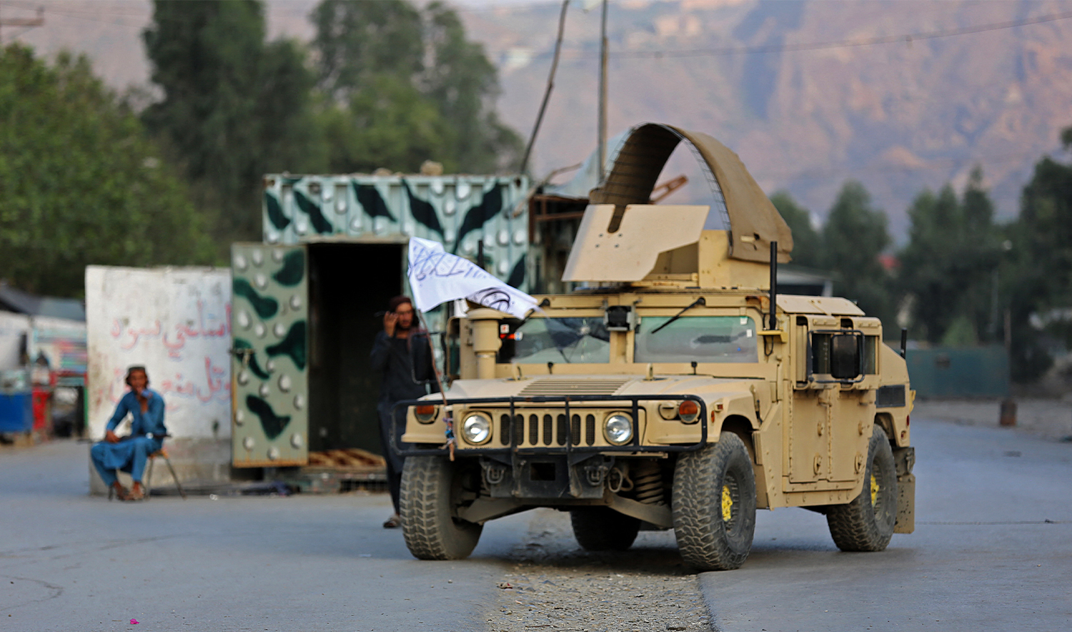 A humvee (HMMWV) vehicle is seen near the closed gates of Torkham border crossing between Afghanistan and Pakistan in Afghanistan's eastern Nangarhar province on September 6, 2023. (AFP/File)