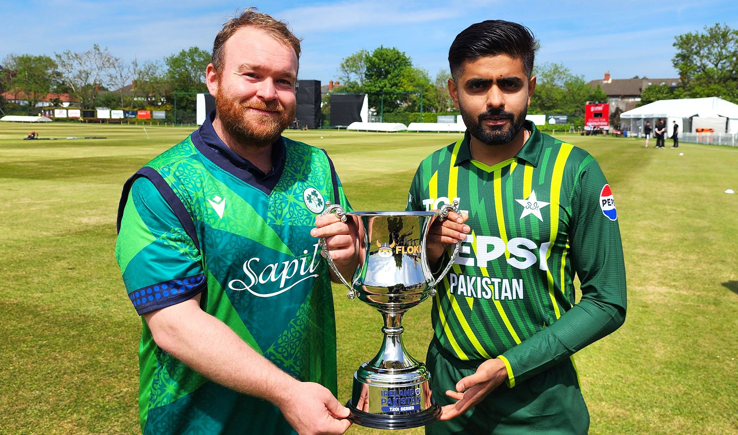 Pakistani skipper Babar Azam (right) and his counterpart from Ireland Paul Stirling hold the three-match series trophy in Dublin, Ireland on May 9. 2024. (Pakistan Cricket Board)