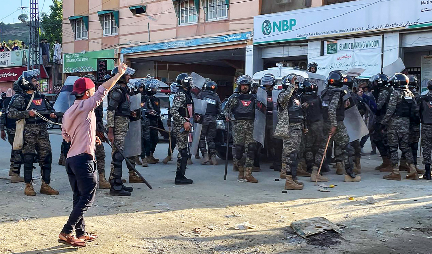 Pakistani rangers cordon off a street during a protest by Kashmiri demonstrators of Jammu Kashmir Joint Awami Action Committee (JAAC) to condemn the soaring electricity and flour prices, on the outskirt of Muzaffarabad, the capital of Pakistan-administered Kashmir on May 13, 2024. (AFP/File)
