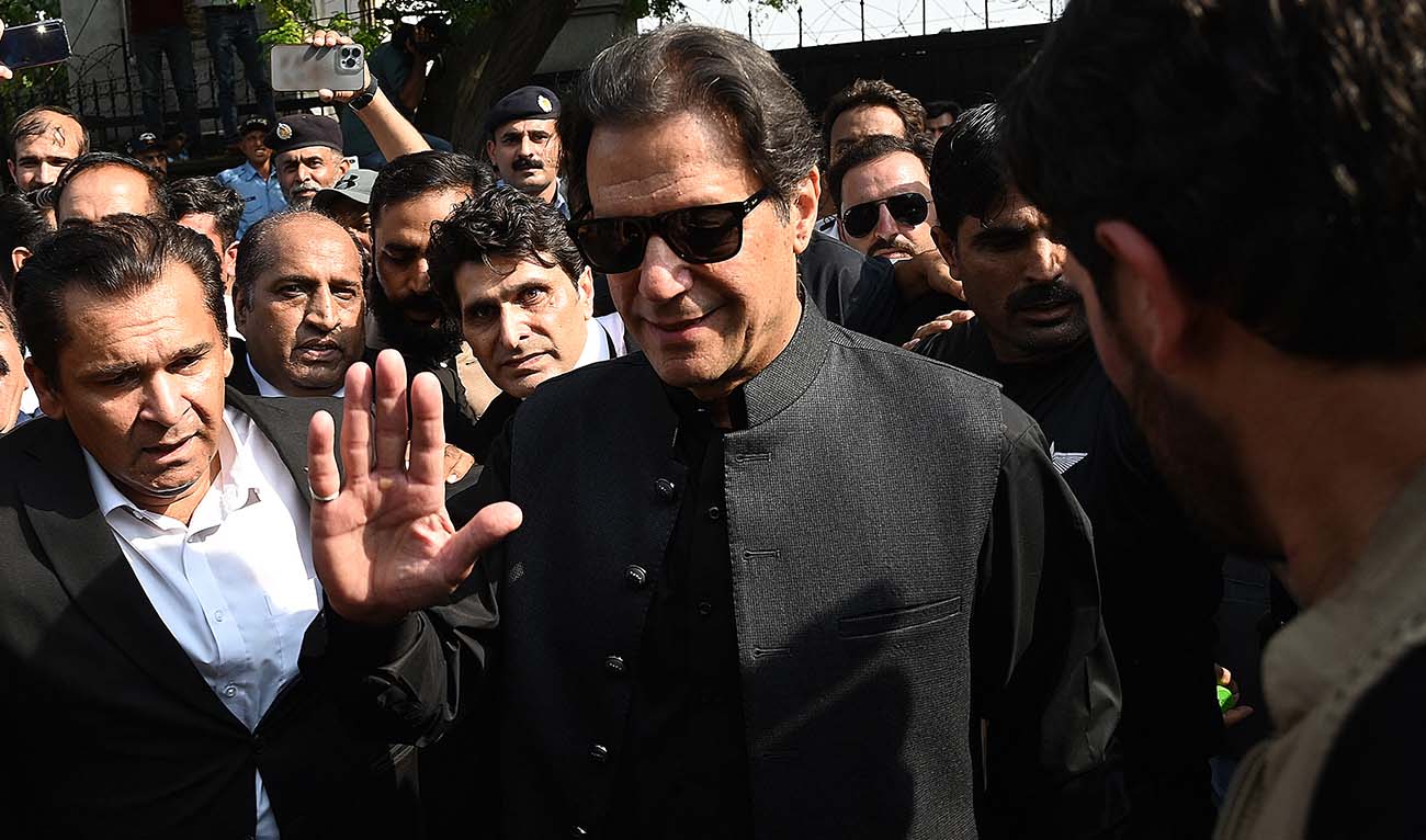Pakistan's former Prime Minister Imran Khan (C) gestures as he leaves after appearing before the High Court in Islamabad on September 22, 2022. (AFP/File)