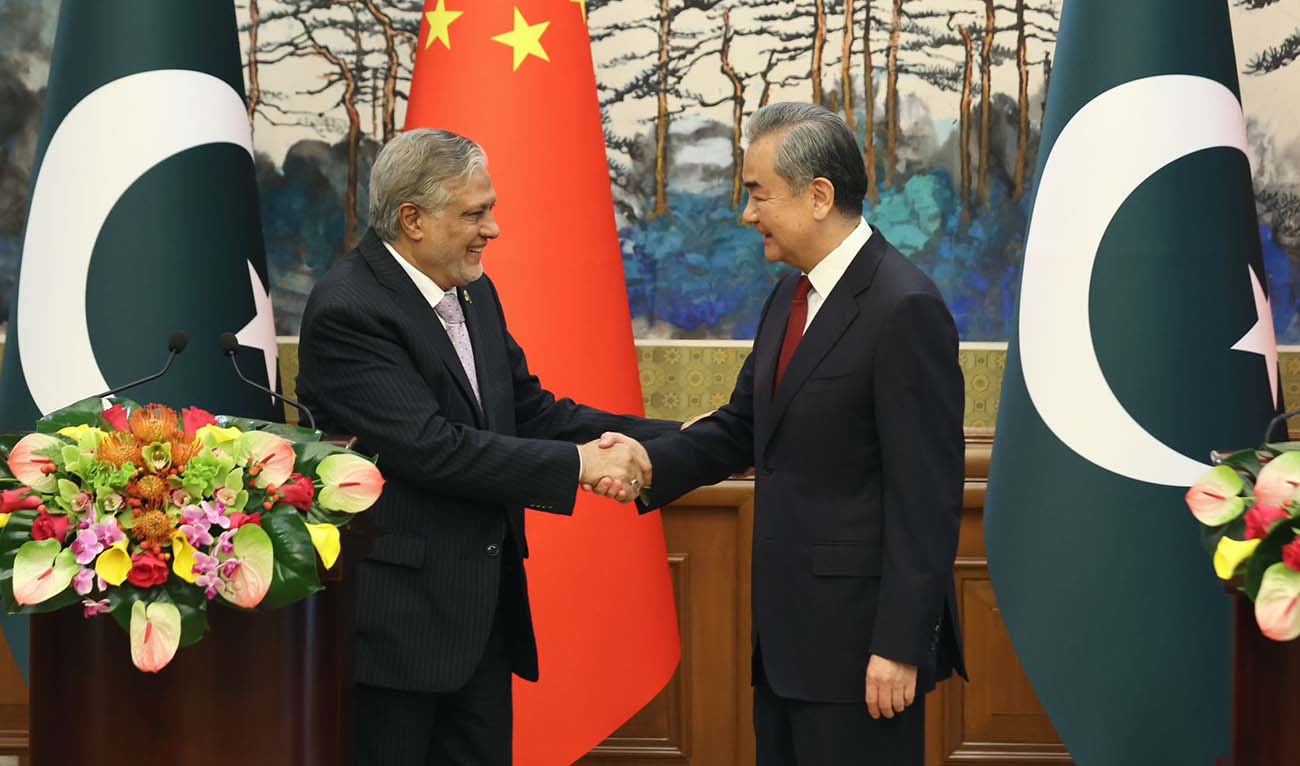 Deputy Prime Minister Ishaq Dar shakes hands with the Chinese Foreign Minister Wang Yi in Beijing, China, on May 15, 2024. (Ministry of Foreign Affairs)