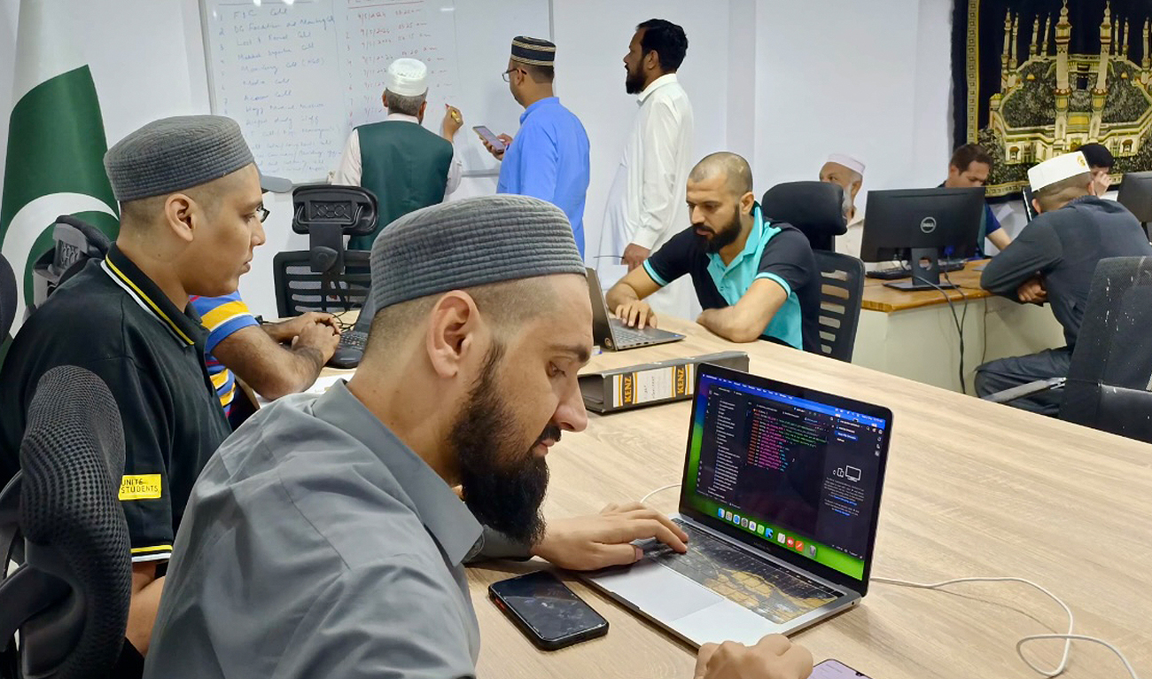 Pakistan Hajj mission officials work in a control room to facilitate pilgrims in Madinah, Saudi Arabia on May 15, 2024. (Photo courtesy: Ministry of Religious Affairs)
