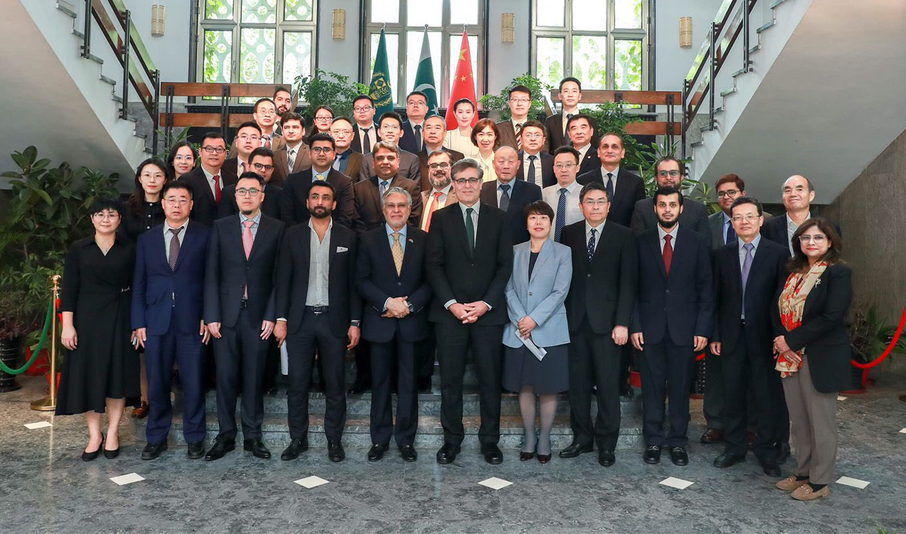 Pakistan's Deputy Prime Minister and Foreign Minister, Ishaq Dar (fifth from left in the first row), poses for a picture with Chinese entrepreneurs after their meeting in Beijing, China, on May 16, 2024. (Pakistan's Foreign Office)