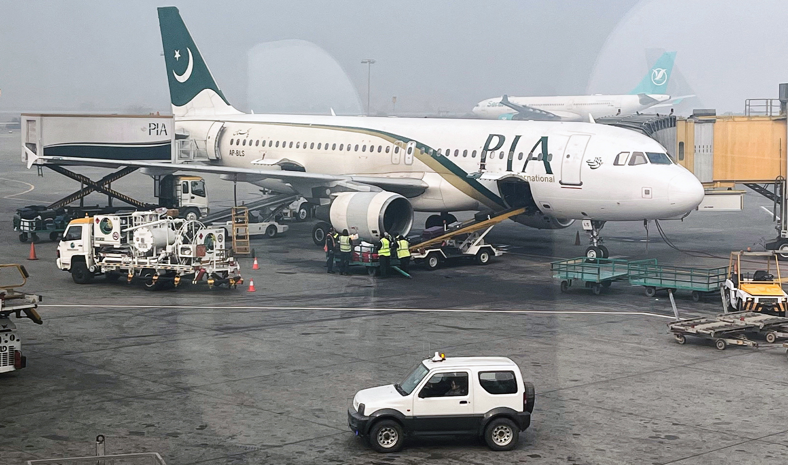 View of a Pakistan International Airlines (PIA) passengers plane, taken through a glass panel, at the Allama Iqbal International Airpor in Lahore, Pakistan on January 29, 2024. (REUTERS/File)