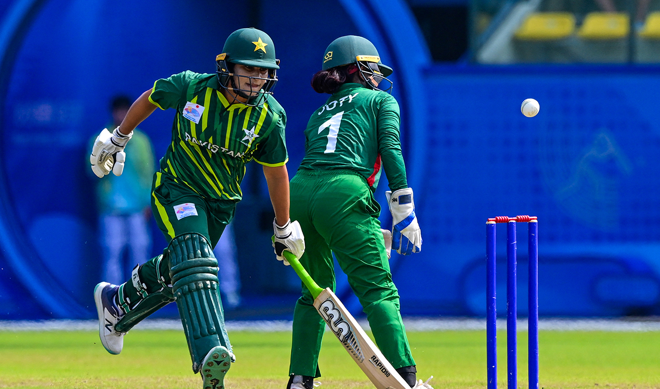 Pakistan's Nida Dar (L) runs between wickets during the 2022 Asian Games women’s third-place playoff cricket match between Bangladesh and Pakistan in Hangzhou in China's eastern Zhejiang province on September 25, 2023. (AFP/File)