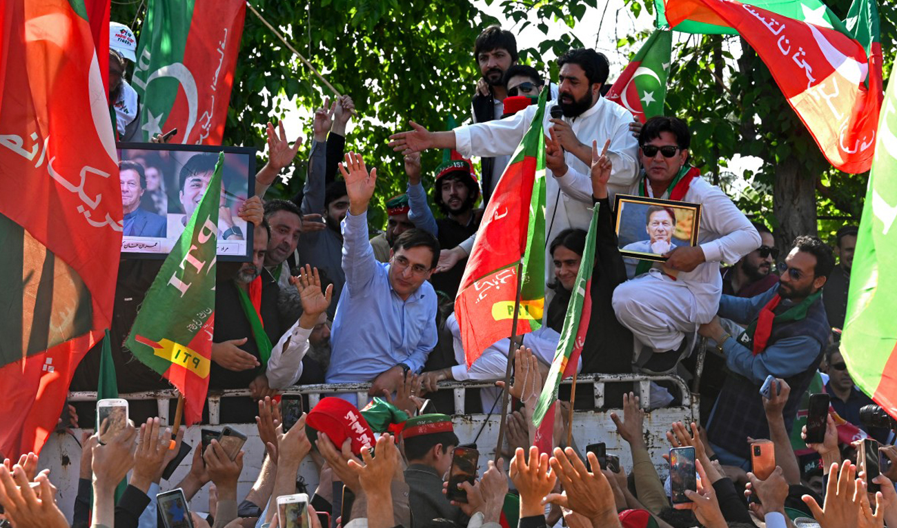 Pakistan Tehreek-e-Insaf (PTI) party chairman Gohar Ali Khan (C) takes part in a protest rally for the release of party’s leader Imran Khan, in Peshawar on March 31, 2024. (AFP)