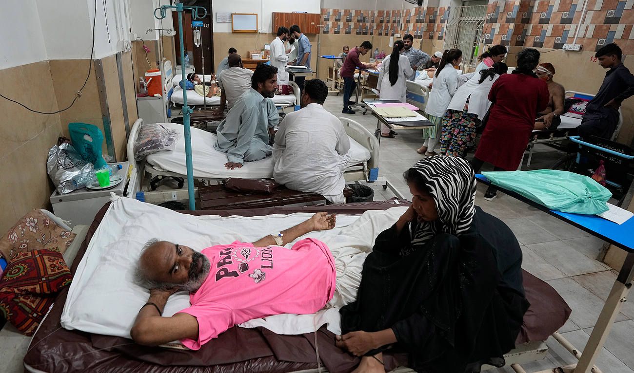 Patients of heatstroke receive treatment at a hospital in Karachi on May 23, 2024. (AP)