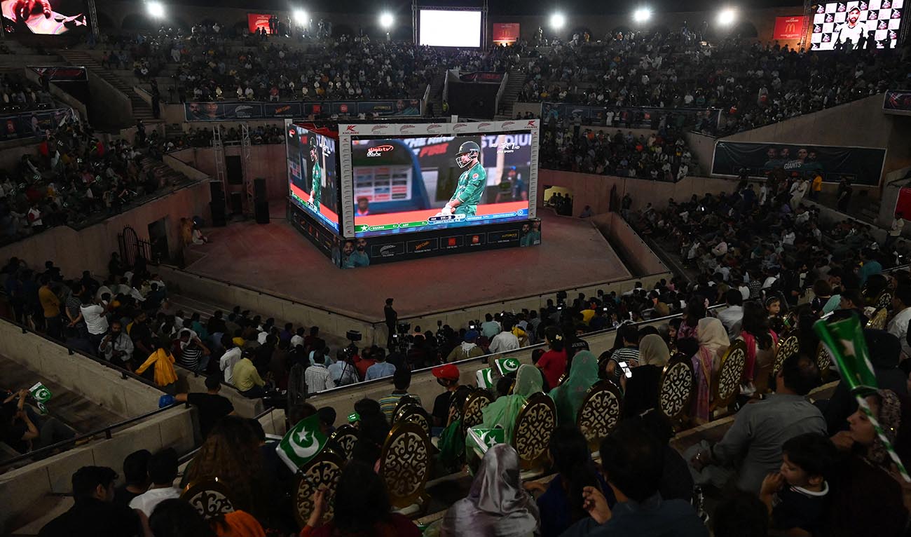 Cricket fans watch the live telecast of the Asia Cup Twenty20 international cricket match between India and Pakistan in Dubai, on big screens in Lahore on August 28, 2022. (AFP/File)