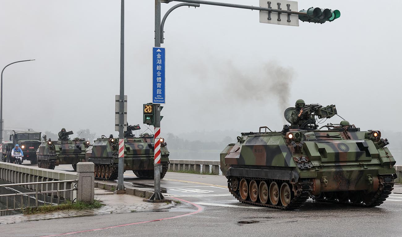 Taiwanese armoured vehicles roll down a street in Kinmen on May 24, 2024. (AFP)