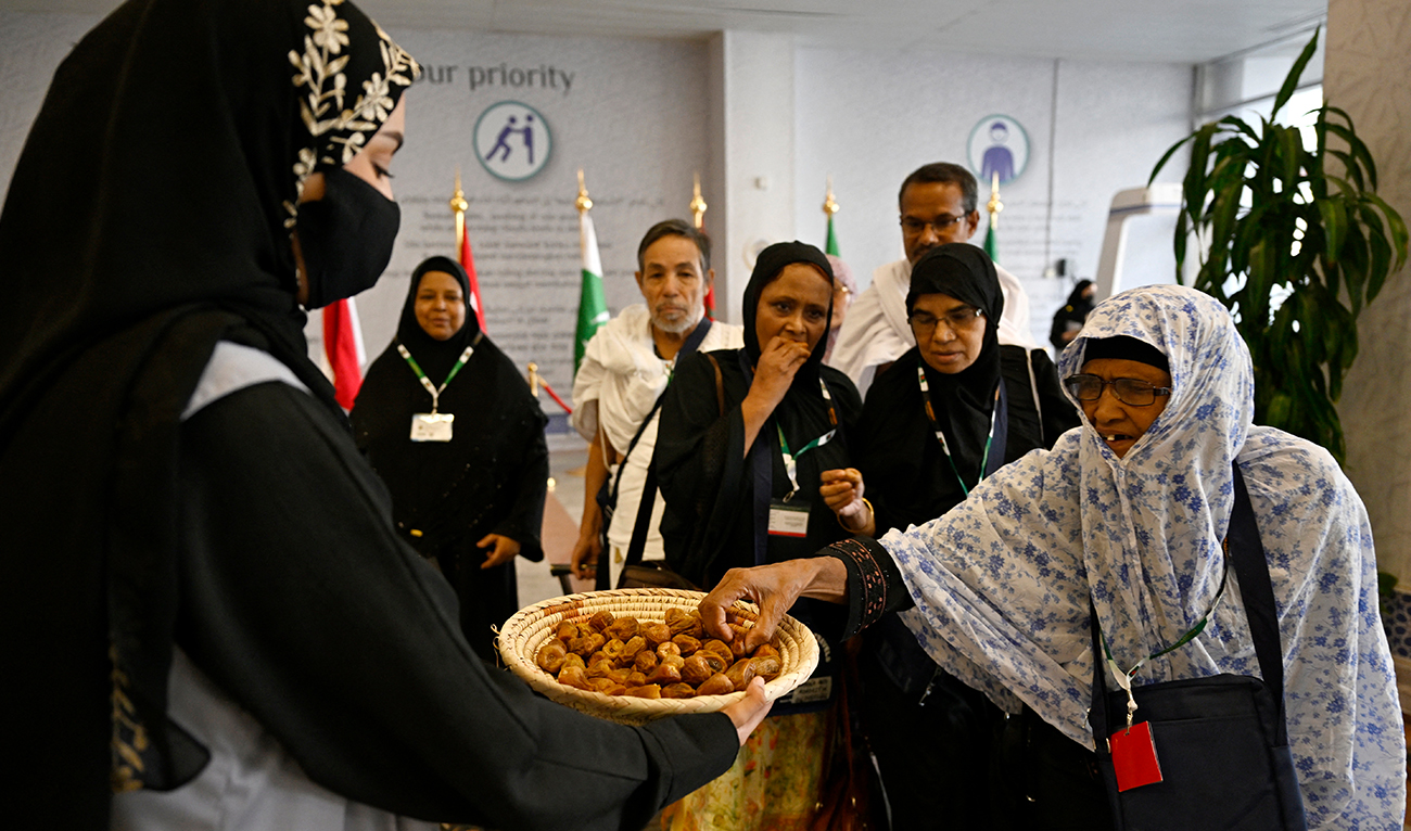 Muslim pilgrims are greeted upon their arrival at King Abdul Aziz International Airport in Jeddah, ahead of the Hajj pilgrimage in Mecca, on May 10, 2024. (AFP)