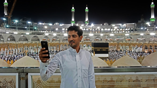 A Muslim pilgrim takes a selfie at the Grand Mosque in the holy Saudi city of Makkah, early on August 30, 2017, on the eve of the start of the annual Hajj pilgrimage. (AFP/File)