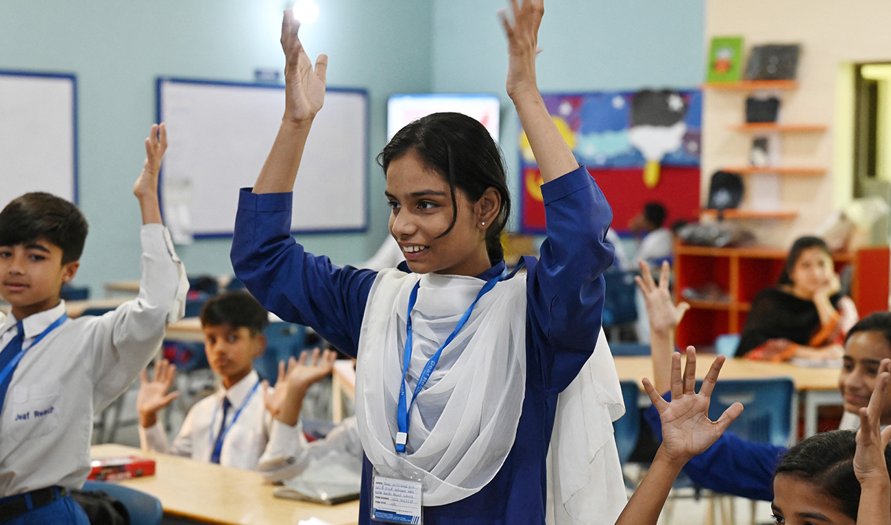 This photograph taken on May 6, 2024 shows hearing-impaired students attending a class at a school run by the charity Deaf Reach, a non-profit organisation working to empower disadvantaged deaf children and youths, in Lahore. (AFP/File)