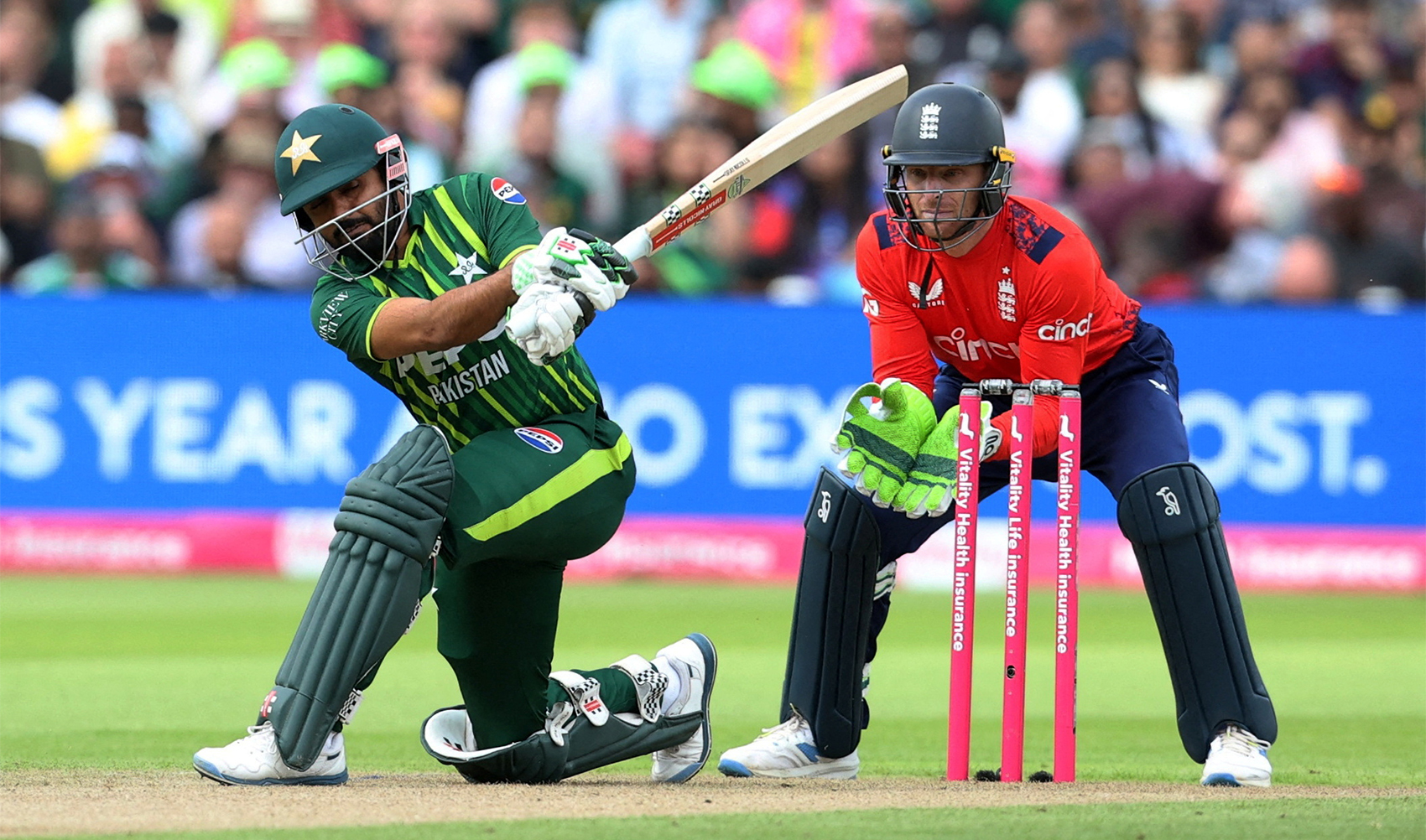 Pakistan's Babar Azam (L) plays a shot during the fourth T20 international cricket match between England and Pakistan at The Oval, in London on May 30, 2024. (REUTERS)