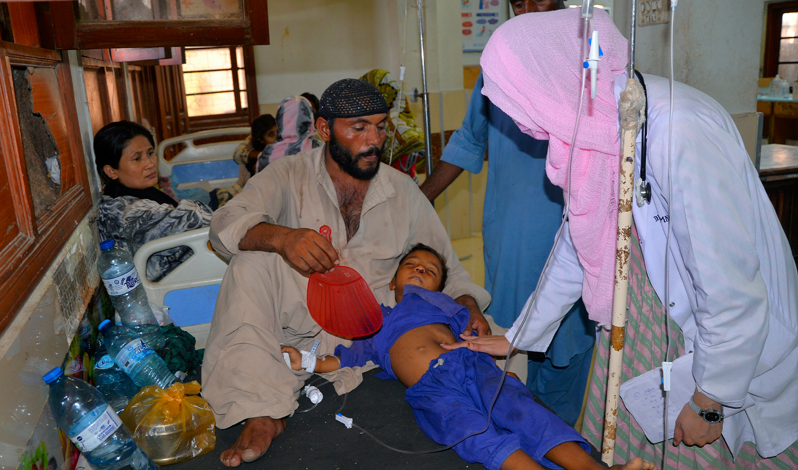 A doctor checks a child, who is suffering from gastroenteritis due to hot weather, at a hospital in Hyderabad, Pakistan, on May 23, 2024. (AP/File)