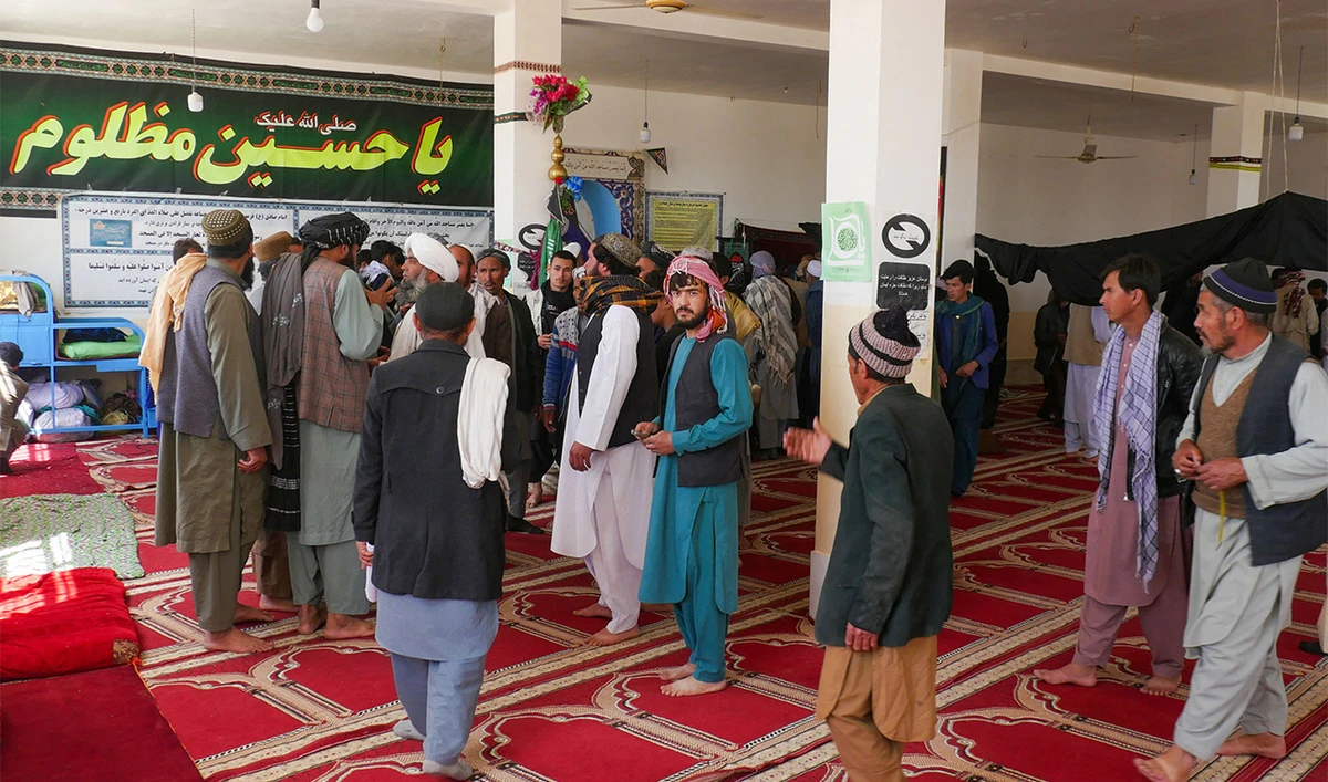 Afghans gather at a mosque where gunmen attacked Shiite Muslims in Guzara district of Herat province on April 30, 2024. (AFP)